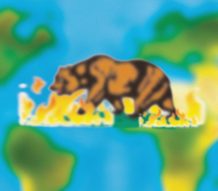A blurry filter has been placed over the bear from the California flag. The bear is walking through flames. Behind it is a world map, so blurry that the continents seem more like blobs.