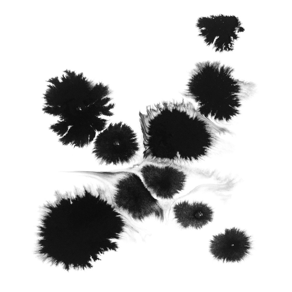 Ink blots in the form of an "X"