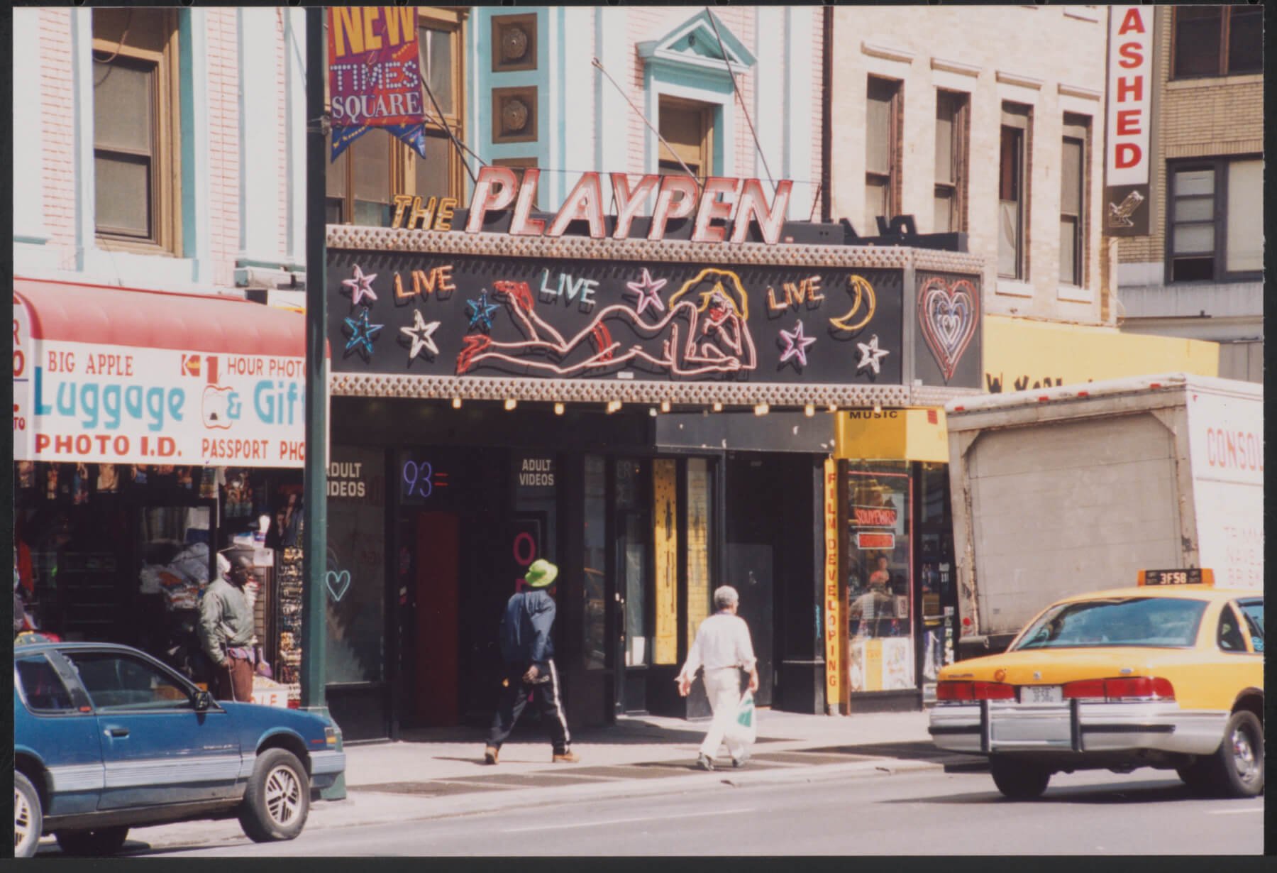 A photograph of a movie theater called “THE PLAYPEN.” 