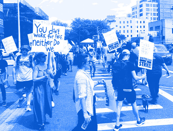 Picketers in a circle with signs. 