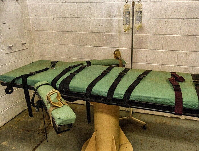 A photograph of a lethal injection table in a prison.