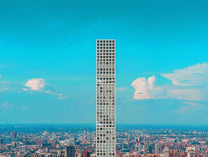 A photo of 432 Park Avenue (a tall apartment tower) with New York City skyline in the background.