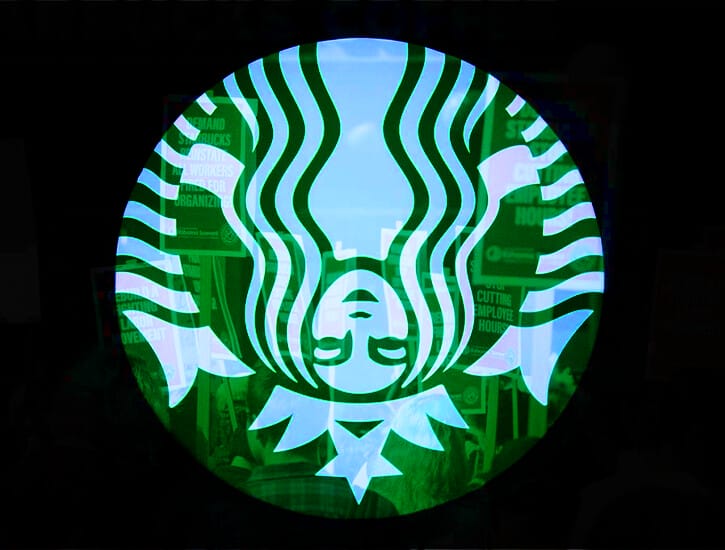 The Starbucks Siren appears upside down, superimposed over photos of workers picketing a store.